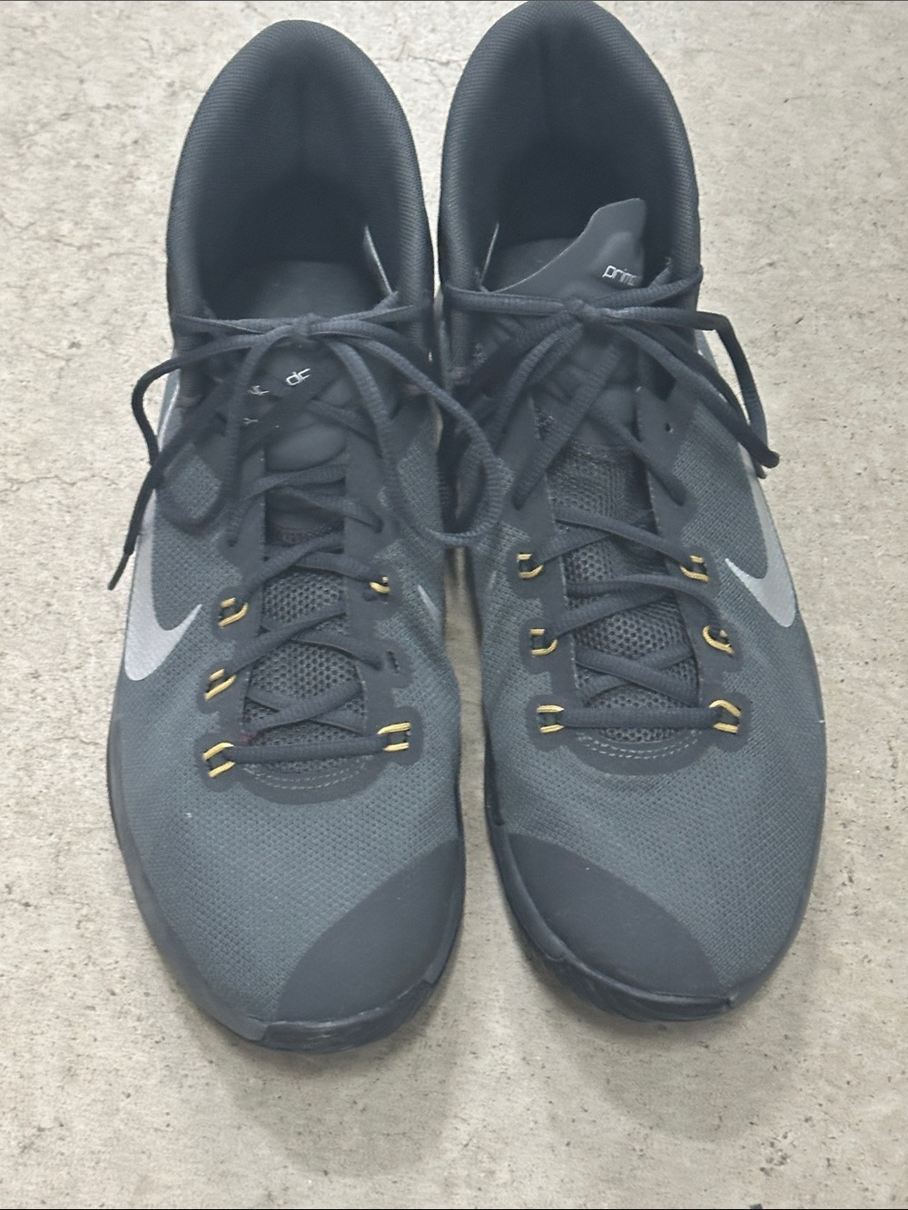 Nike Men’s Black/Gray Sneakers with Gold Eyelet Accents
